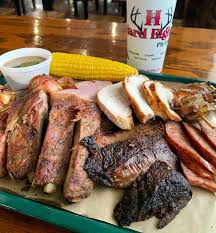 Hard Eight BBQ plate with brisket, sausage, and sides